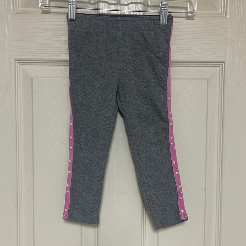 Nike gray with pink stripe on legs leggings. Size 4T. Great condition!